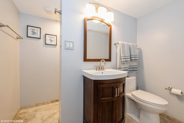 3801 S Lombard Ave, Cicero, IL 60804 - bathroom featuring toilet, vanity, and baseboards