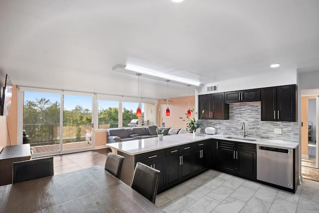 101 Bar Harbour Rd Unit 6E, Schaumburg, IL 60193 - kitchen with stainless steel dishwasher, a sink, light countertops, open floor plan, and light marble finish floors