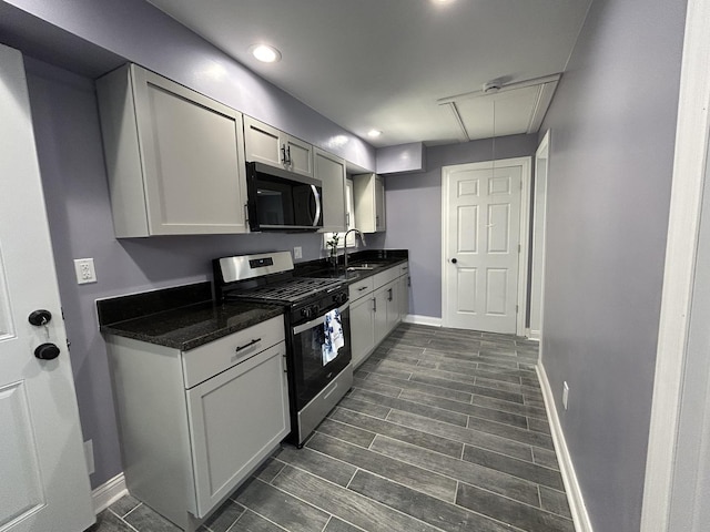 2709 S 59th Ct, Cicero, IL 60804 - kitchen with stainless steel appliances, a sink, baseboards, and recessed lighting
