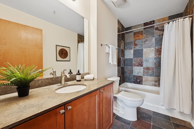 1503 S State St Unit 606, Chicago, IL 60605 - bathroom with vanity, shower / bath combo with shower curtain, and stone finish floors