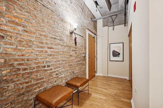 1503 S State St Unit 606, Chicago, IL 60605 - corridor with brick wall, a high ceiling, and wood finished floors