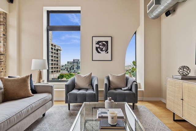 1503 S State St Unit 606, Chicago, IL 60605 - living area featuring healthy amount of natural light, light wood-style floors, and a city view