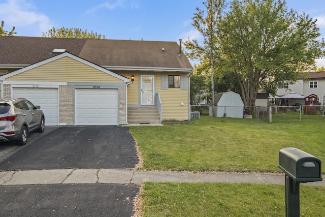4574 Whitney Dr, Hanover Park, IL 60133 - view of front of house featuring an attached garage and driveway
