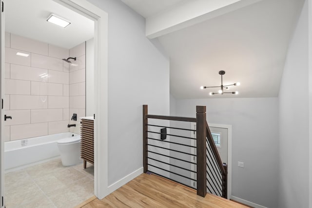 4574 Whitney Dr, Hanover Park, IL 60133 - stairs featuring baseboards and a chandelier