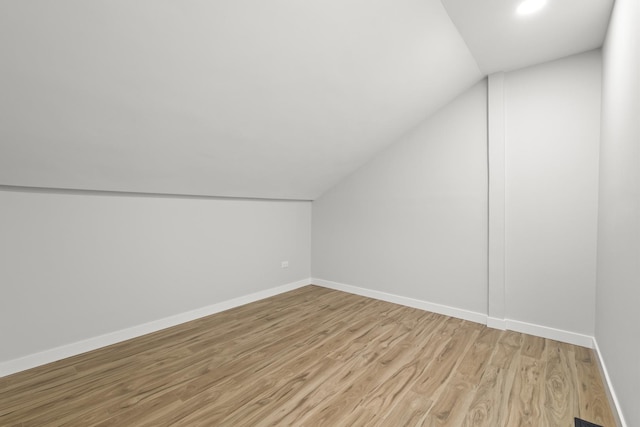 4574 Whitney Dr, Hanover Park, IL 60133 - additional living space featuring lofted ceiling, light wood-type flooring, baseboards, and recessed lighting