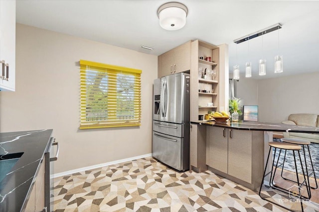 1550 Sandpebble Dr Unit 209, Wheeling, IL 60090 - kitchen featuring stainless steel fridge with ice dispenser, dark countertops, a peninsula, open shelves, and a breakfast bar area