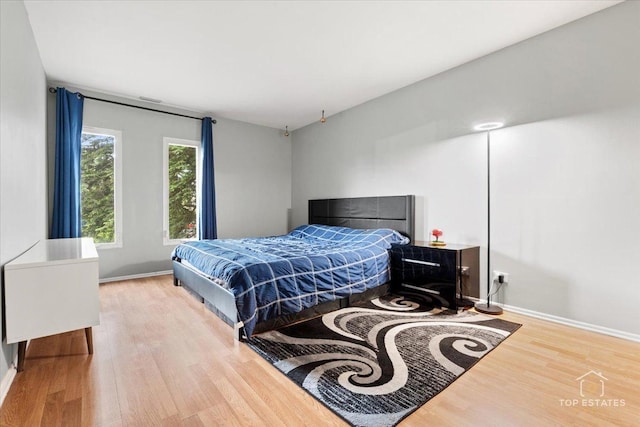 1550 Sandpebble Dr Unit 209, Wheeling, IL 60090 - bedroom with wood finished floors and baseboards