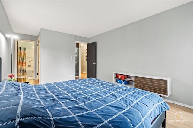 1550 Sandpebble Dr Unit 209, Wheeling, IL 60090 - bedroom featuring wood finished floors and baseboards