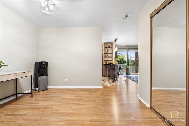 1550 Sandpebble Dr Unit 209, Wheeling, IL 60090 - empty room featuring light wood-type flooring and baseboards
