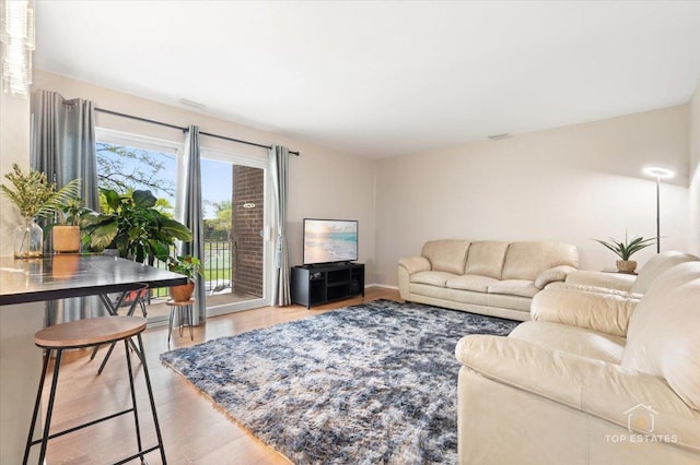 1550 Sandpebble Dr Unit 209, Wheeling, IL 60090 - living room featuring wood finished floors