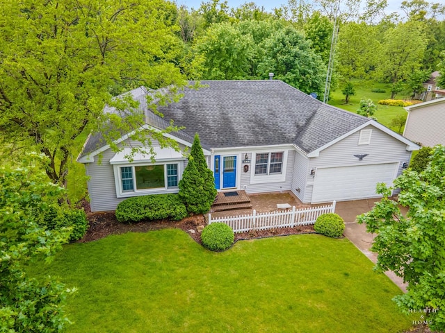 905 N Oakwood Dr, Mchenry, IL 60050 - view of front of home featuring a garage, a front lawn, a shingled roof, and concrete driveway