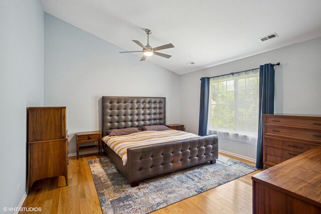 6068 Halloran Ln, Hoffman Estates, IL 60192 - bedroom with light wood-style flooring, lofted ceiling, a ceiling fan, and baseboards