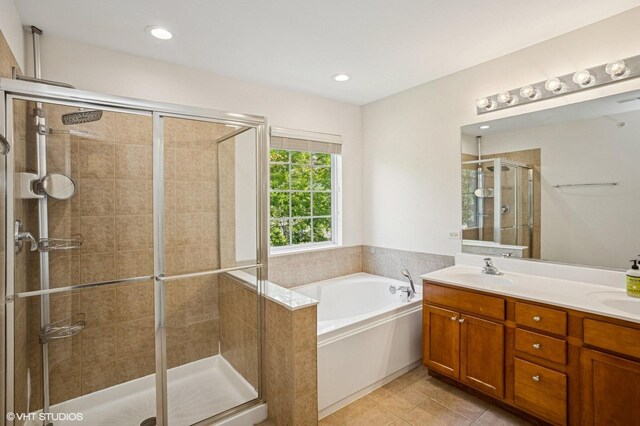 6068 Halloran Ln, Hoffman Estates, IL 60192 - bathroom with a bath, a stall shower, double vanity, tile patterned flooring, and recessed lighting
