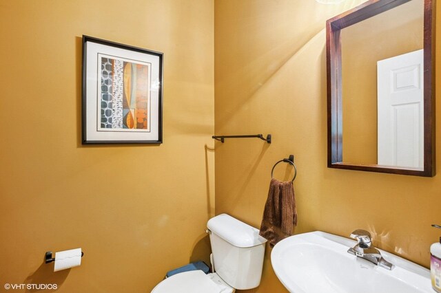 6068 Halloran Ln, Hoffman Estates, IL 60192 - half bath featuring a sink and toilet