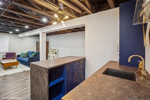 6068 Halloran Ln, Hoffman Estates, IL 60192 - finished basement with a sink and wood finished floors