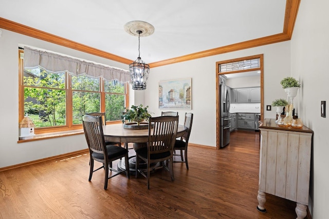 2905 Rose Ave, Mchenry, IL 60050 - dining room featuring a chandelier, dark wood finished floors, baseboards, and ornamental molding