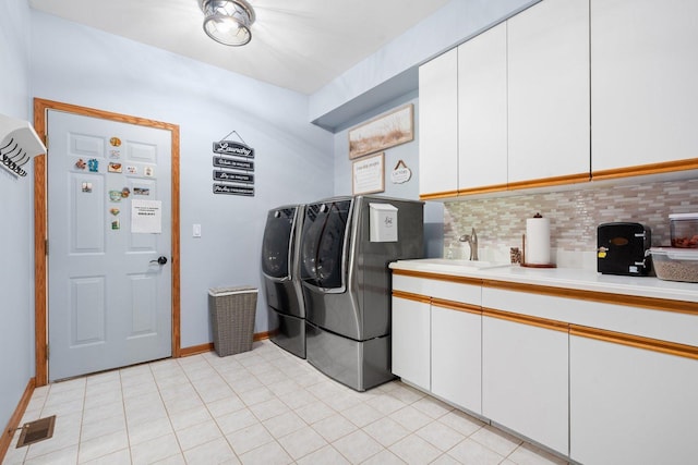 2905 Rose Ave, Mchenry, IL 60050 - washroom with cabinet space, washing machine and dryer, and baseboards