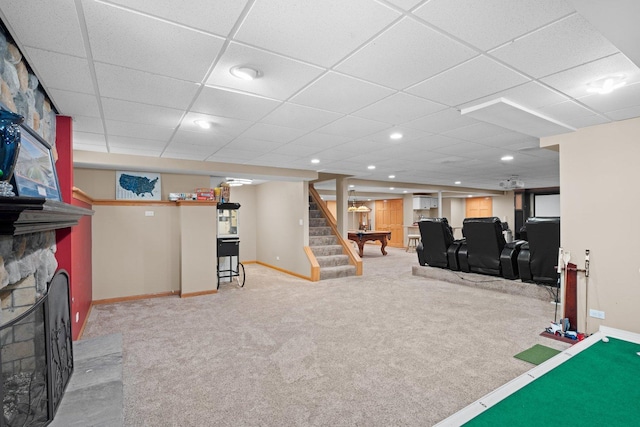 2905 Rose Ave, Mchenry, IL 60050 - recreation room featuring carpet flooring, baseboards, a fireplace, and a drop ceiling