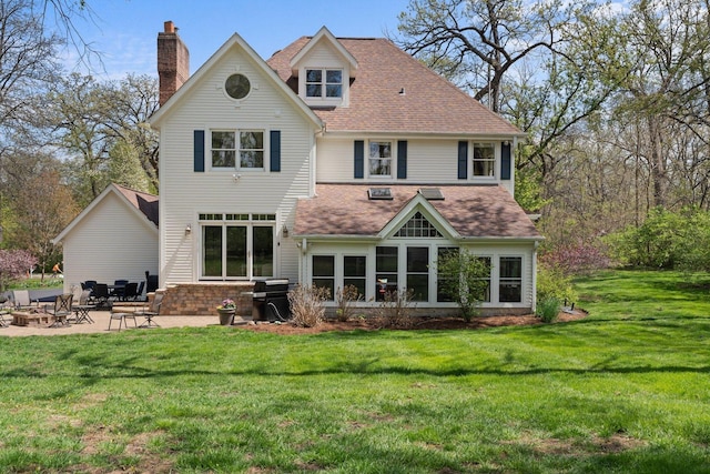 2905 Rose Ave, Mchenry, IL 60050 - back of property featuring roof with shingles, a patio, a chimney, and a yard