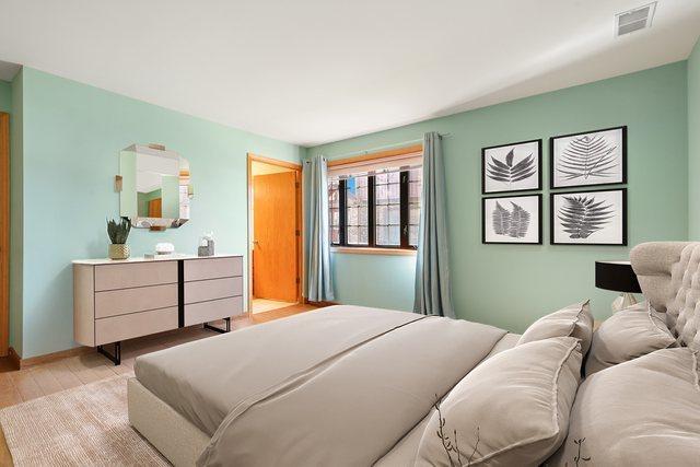 11545 Autobahn Dr E Unit 101, Palos Park, IL 60464 - bedroom with light wood-style flooring and baseboards
