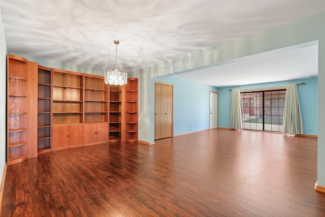 11545 Autobahn Dr E Unit 101, Palos Park, IL 60464 - spare room featuring a chandelier, wood finished floors, and baseboards