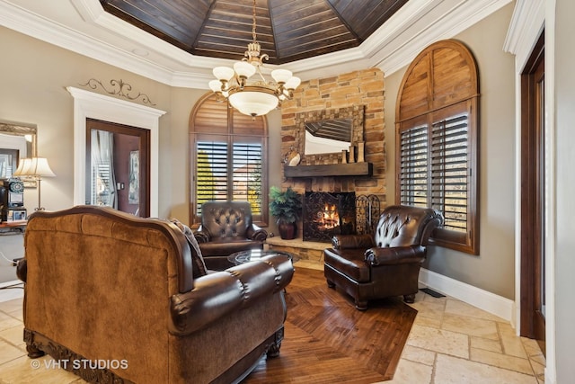 22957 Devonshire Ln, Frankfort, IL 60423 - living area with a tray ceiling, a fireplace, ornamental molding, baseboards, and a chandelier