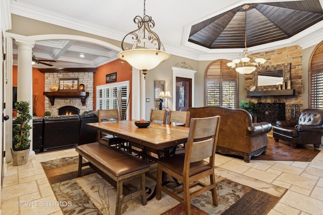 22957 Devonshire Ln, Frankfort, IL 60423 - dining room with a fireplace, stone tile flooring, ornamental molding, arched walkways, and decorative columns