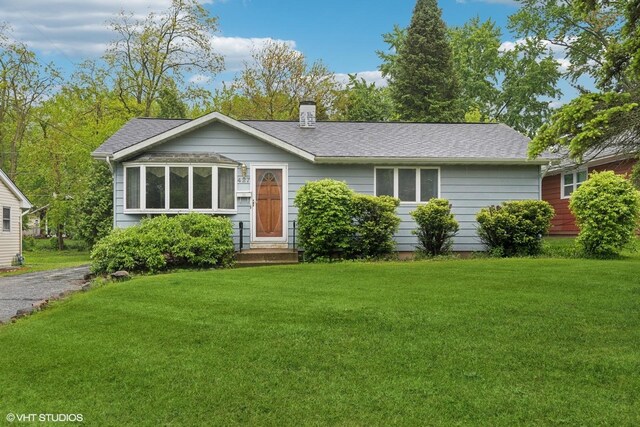 427 Lawrence Ave, Grayslake, IL 60030 - ranch-style home with a front yard, a chimney, and a shingled roof