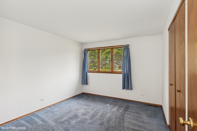 427 Lawrence Ave, Grayslake, IL 60030 - unfurnished bedroom with baseboards, carpet, and a closet