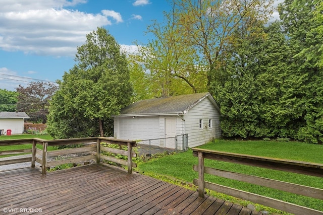 427 Lawrence Ave, Grayslake, IL 60030 - deck featuring a detached garage, an outbuilding, and a yard