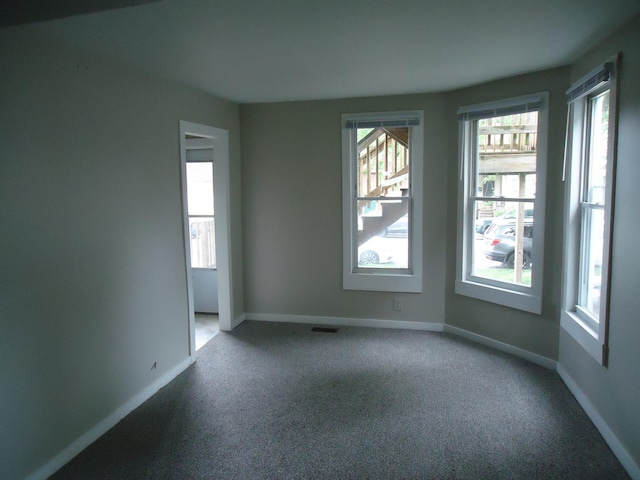 12438 Maple Ave, Blue Island, IL 60406 - spare room featuring carpet flooring and baseboards