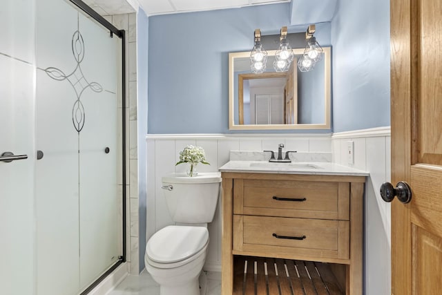 13843 W Stoneoak Way, Homer Glen, IL 60491 - bathroom featuring toilet, vanity, a stall shower, and wainscoting