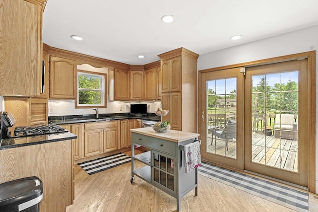 13843 W Stoneoak Way, Homer Glen, IL 60491 - kitchen featuring a sink, dark countertops, light wood-type flooring, tasteful backsplash, and recessed lighting