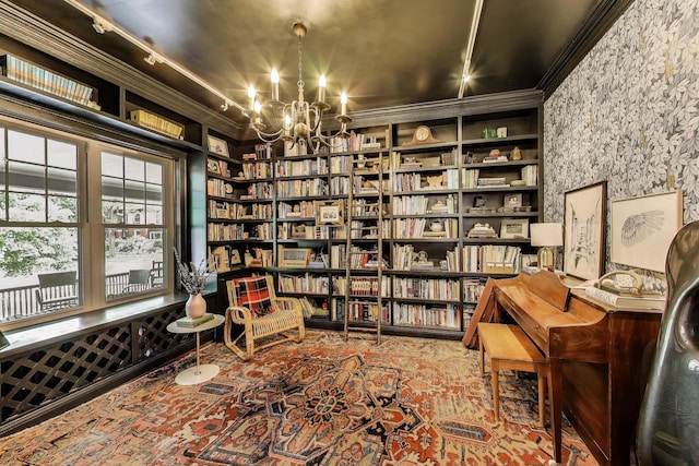 1701 W Chase Ave, Chicago, IL 60626 - living area featuring crown molding, a chandelier, plenty of natural light, built in shelves, and wall of books