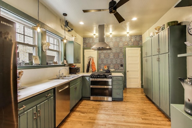 1701 W Chase Ave, Chicago, IL 60626 - kitchen with stainless steel appliances, island exhaust hood, green cabinets, a sink, and ceiling fan