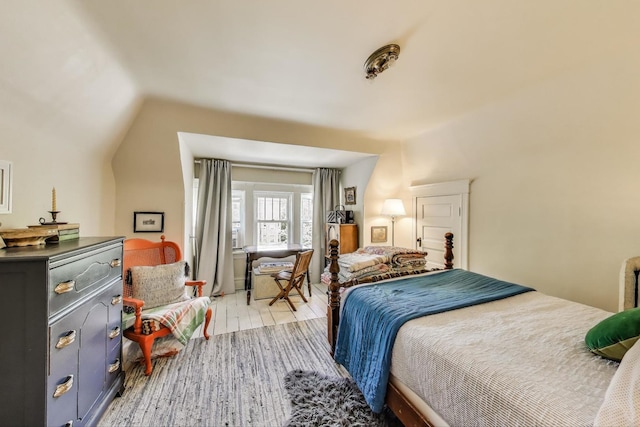 1701 W Chase Ave, Chicago, IL 60626 - bedroom featuring light wood-type flooring and lofted ceiling