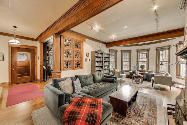 1701 W Chase Ave, Chicago, IL 60626 - living area with rail lighting, ornamental molding, wood finished floors, and baseboards
