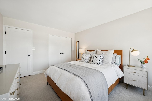 450 W Briar Pl Unit 12G, Chicago, IL 60657 - bedroom with light colored carpet, a closet, and baseboards