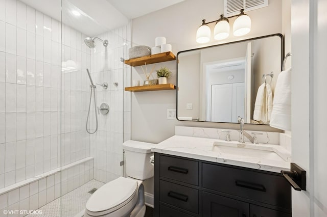 450 W Briar Pl Unit 12G, Chicago, IL 60657 - bathroom featuring toilet, vanity, and a tile shower