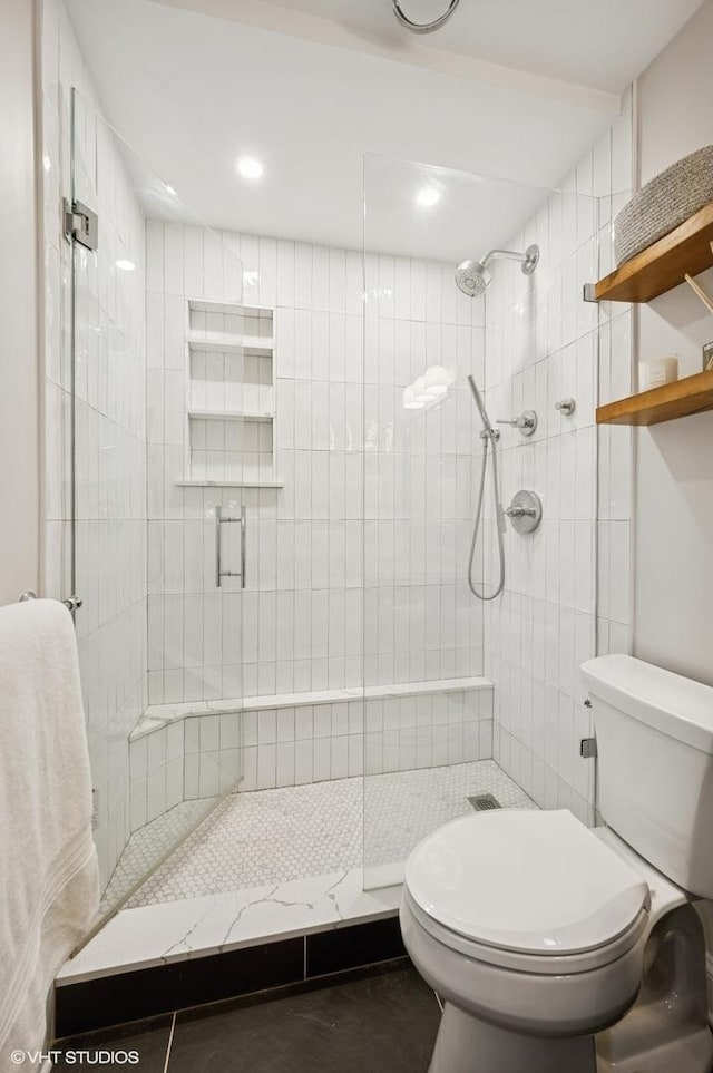 450 W Briar Pl Unit 12G, Chicago, IL 60657 - bathroom with toilet, a shower stall, and recessed lighting