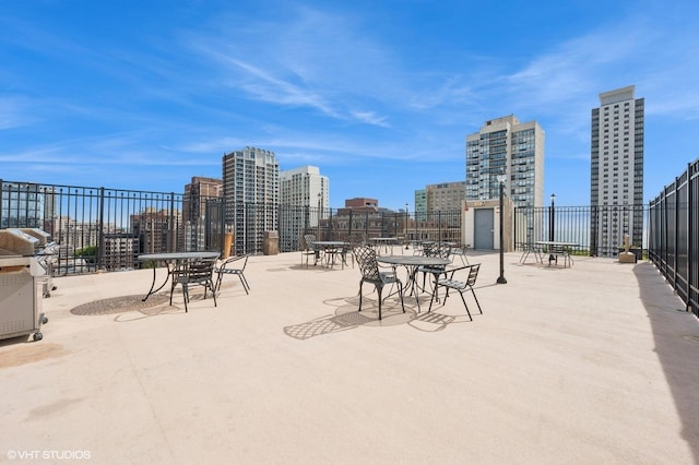 450 W Briar Pl Unit 12G, Chicago, IL 60657 - view of patio with a view of city and a grill