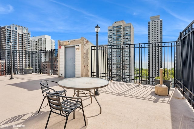 450 W Briar Pl Unit 12G, Chicago, IL 60657 - view of patio featuring a view of city