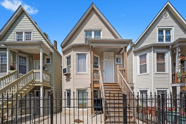 3034 S Komensky Ave, Chicago, IL 60623 - view of front of home with a fenced front yard, cooling unit, a gate, and stairs