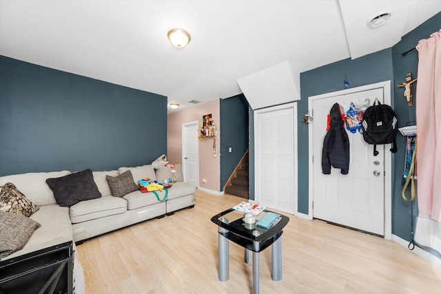 3034 S Komensky Ave, Chicago, IL 60623 - living area featuring light wood-type flooring, baseboards, and stairway