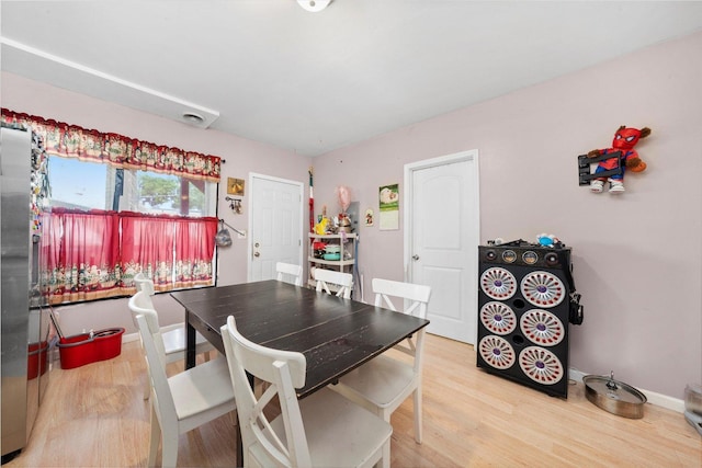 3034 S Komensky Ave, Chicago, IL 60623 - dining space featuring light wood-type flooring and baseboards