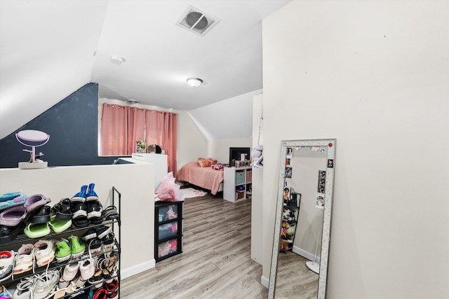 3034 S Komensky Ave, Chicago, IL 60623 - bonus room featuring light wood finished floors, lofted ceiling, and baseboards