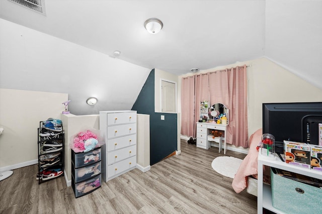3034 S Komensky Ave, Chicago, IL 60623 - bedroom featuring lofted ceiling, wood finished floors, and baseboards
