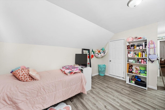 3034 S Komensky Ave, Chicago, IL 60623 - bedroom with wood finished floors, vaulted ceiling, and baseboards