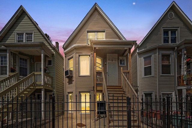 3034 S Komensky Ave, Chicago, IL 60623 - view of front of home with stairs, cooling unit, and a gate