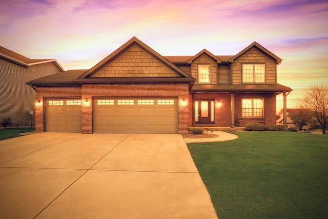 2708 Red Rock Rd, Normal, IL 61761 - craftsman-style house with concrete driveway, a garage, brick siding, and a front lawn